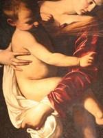 Il Bambino Gesù già grande, nella Madonna dei Pellegrini di Caravaggio